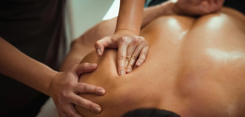 massage therapist working on patient
